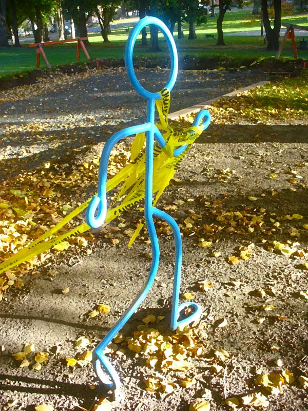 Blue metal runner. Art at Moscow, Idaho park.