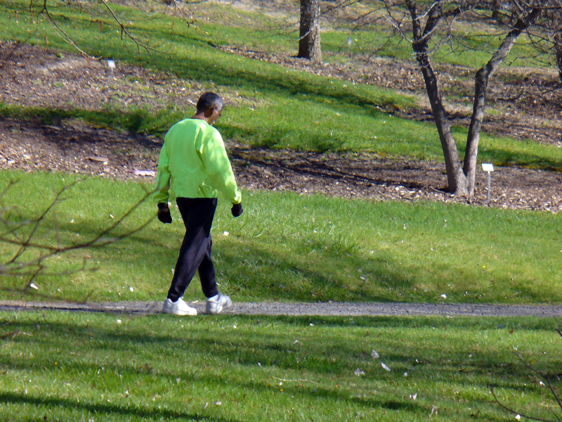 Man in green walking