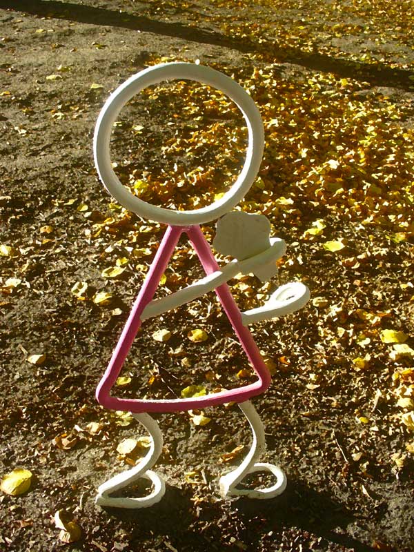 Metal pink girl eating icecream cone. Art at Moscow Idaho park.